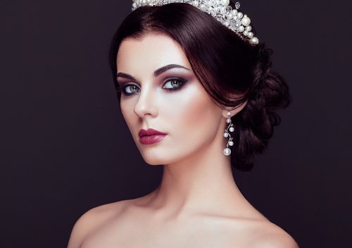 Fashion portrait of beautiful woman with tiara on head